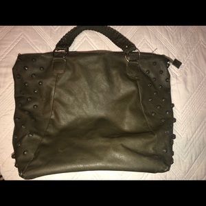 green purse with studs on sides